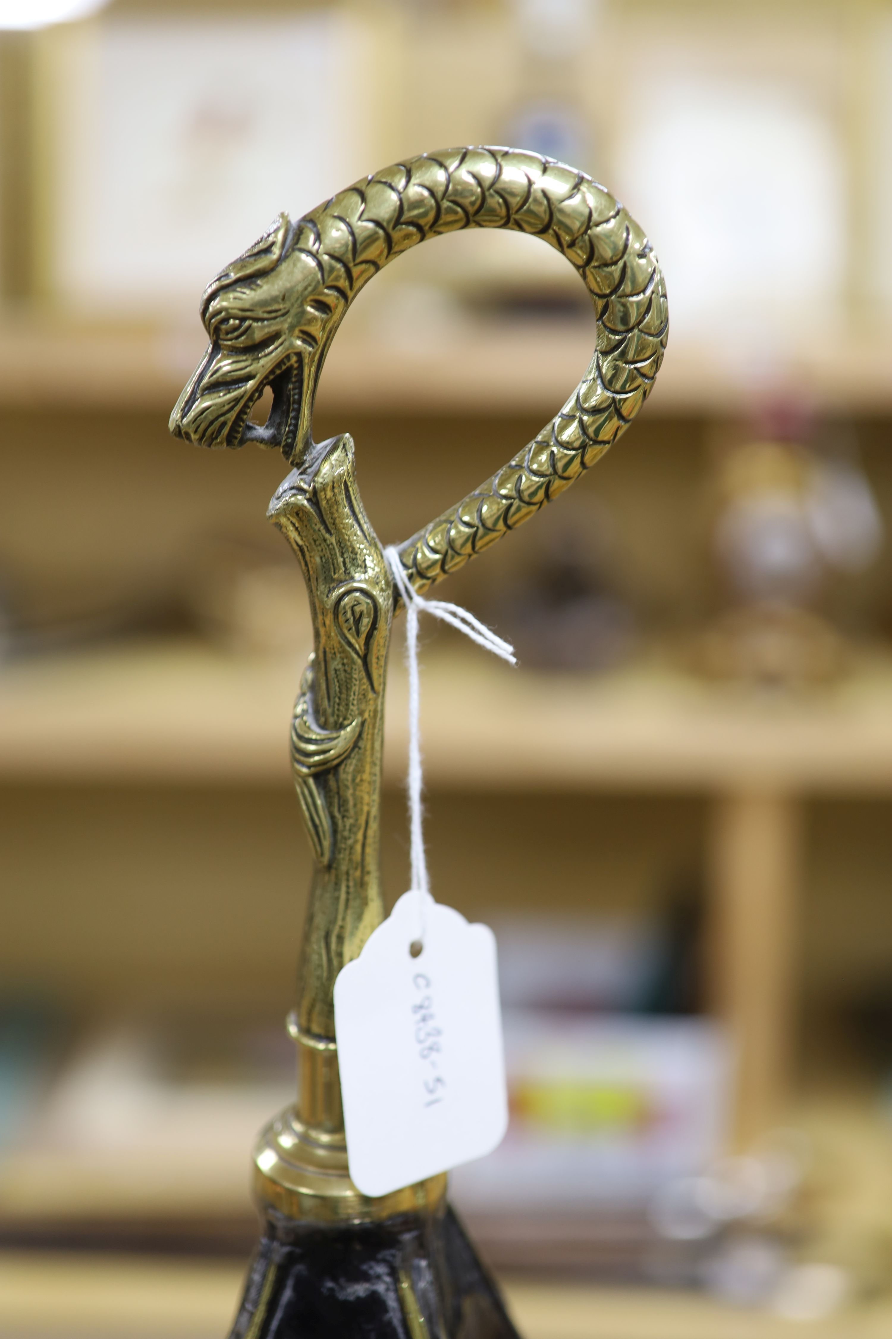 A Dutch brass embossed parasol shaped stick stand, height 91cm